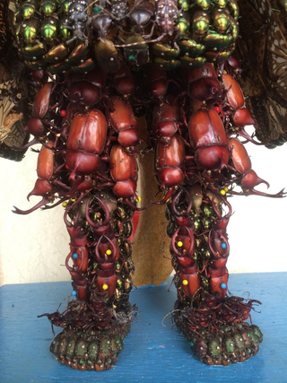 Illustration for article titled Japanese Statues Made with Dead Bugs